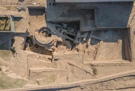 <p>Where was the 2,000-year-old Buddhist temple unearthed?</p>