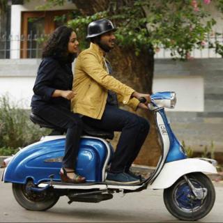 What mode of transport are the couple using?